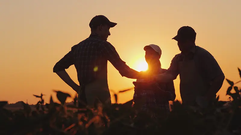 Farm Worker Shaking Hands Discussing Farm Labor Bonds