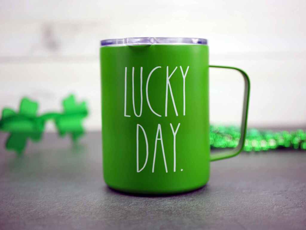 Close-up of a green mug with 'Lucky Day' text, perfect for St. Patrick's Day celebrations.